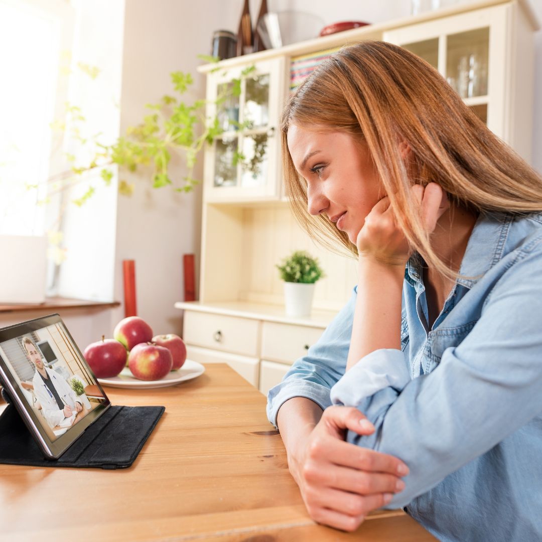 woman speaking with a telehealth provider