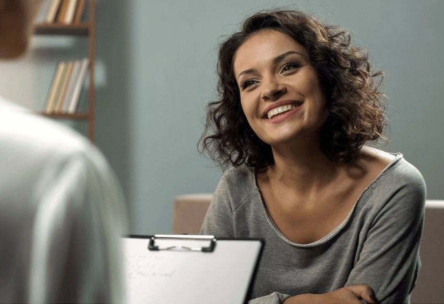 woman in counseling session smiling