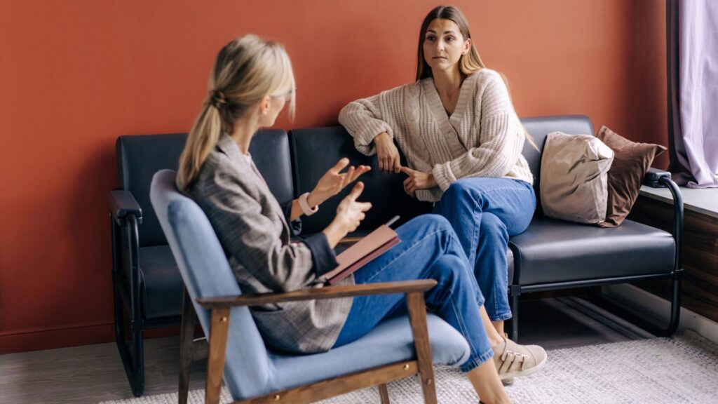 Woman getting therapy from a female therapist.
