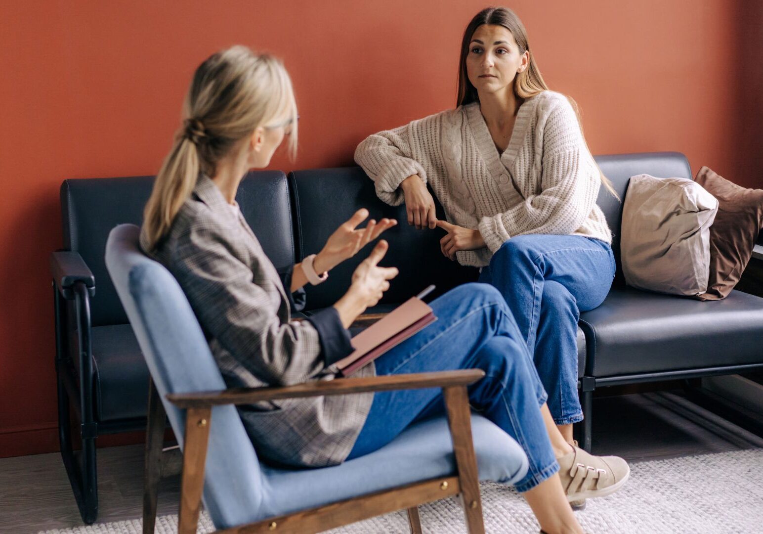 Woman getting therapy from a female therapist.