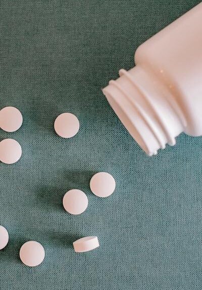 pills coming out of pill container