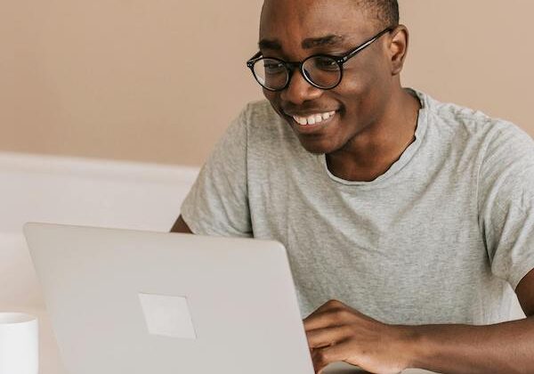 man smiling on online therapy call